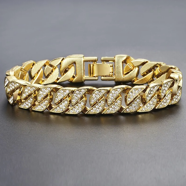 Miami Gold Curb Cuban BraceletIntroducing the Miami Gold Curb Cuban Chain Bracelet, a timeless and original piece of jewelry perfect for an elegant, sophisticated look. This beautiful bracelet isZIP UP EXPRESSMiami Gold Curb Cuban Bracelet